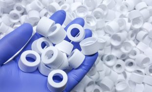 White,Medical,Plastic,Bottle,Caps.,Made,From,Injection,Molding,Machine,